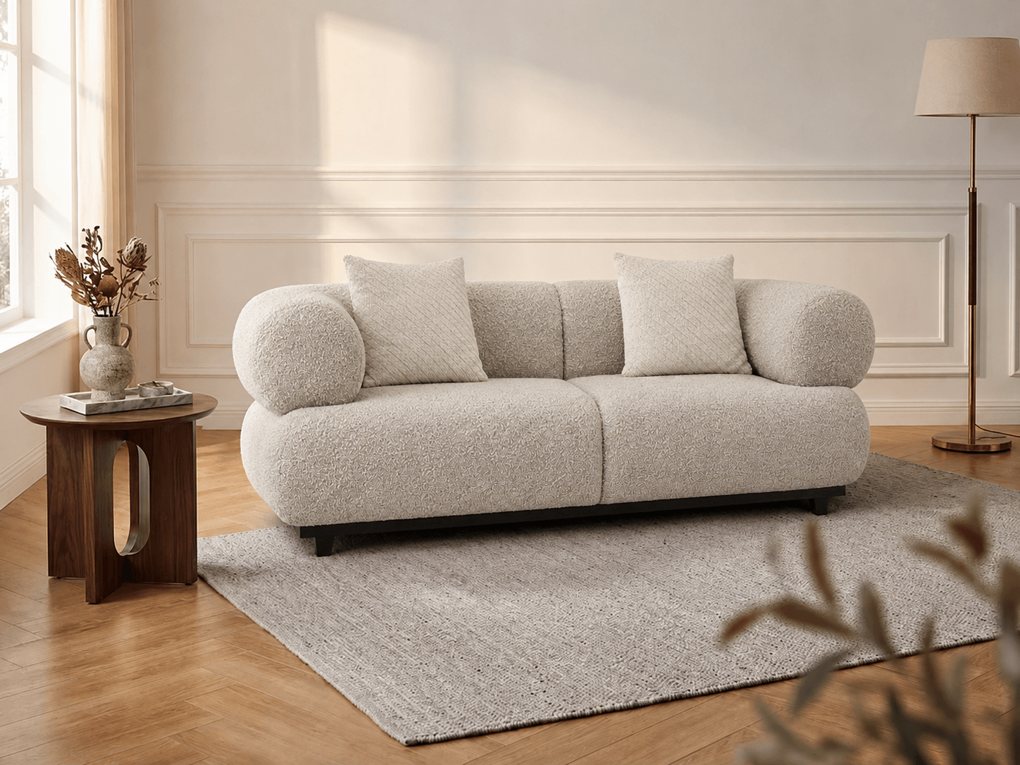 Gray sofa in a living room with wooden floor and lamp