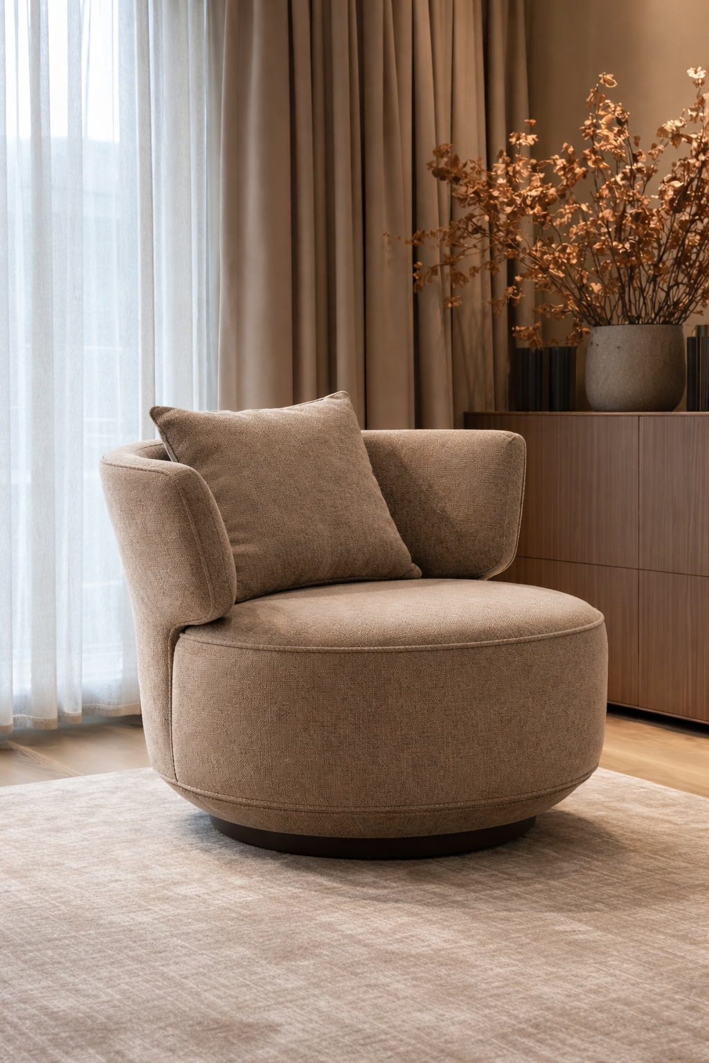 Brown armchair in a room with curtains and decorative elements