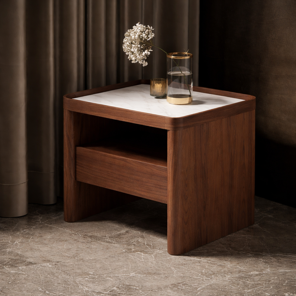Wooden side table with a white surface and decorative items against a dark curtain background