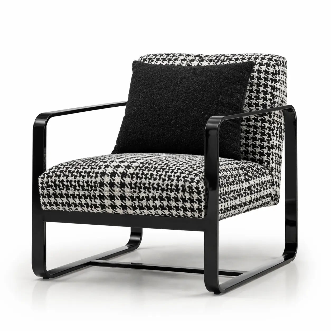 Modern armchair with black and white patterned fabric on a white background