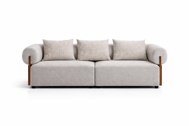 Gray sofa with patterned cushions on a white background