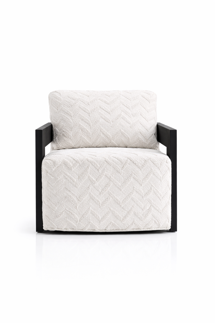 White quilted armchair with black frame on a white background