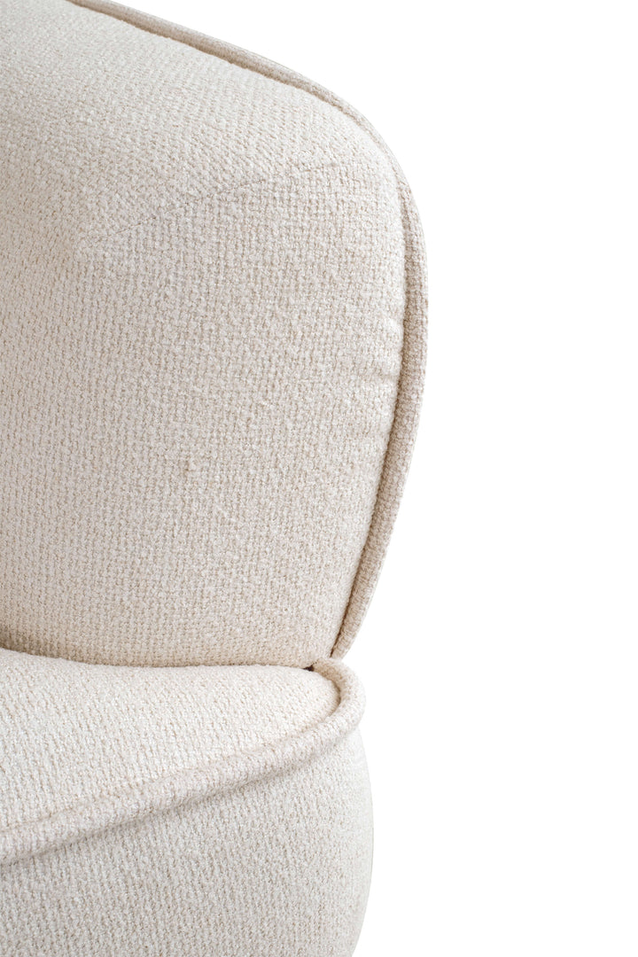 Close-up of a beige upholstered chair with a white background