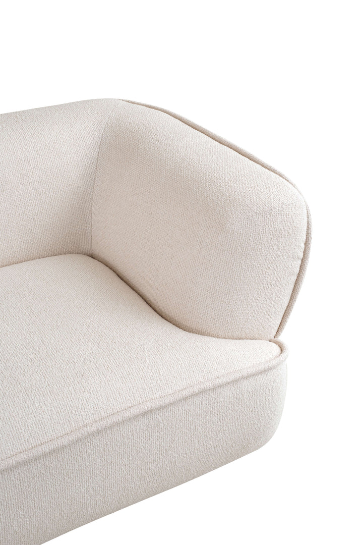 Close-up of a beige armchair on a white background