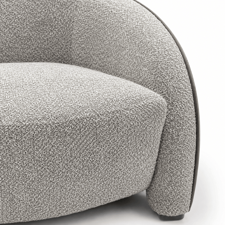 Close-up of a textured gray sofa on a white background